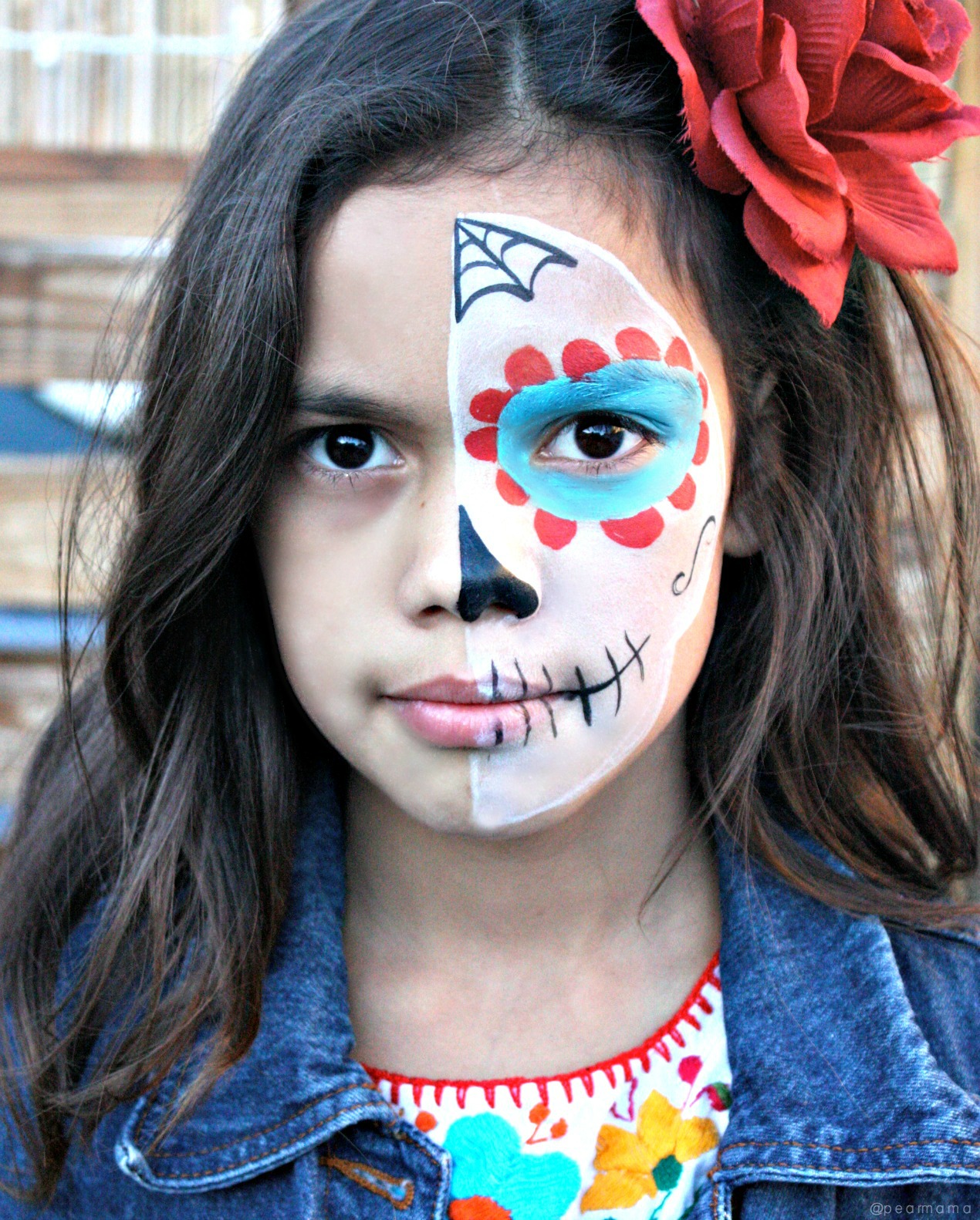 Watch this YouTube video and learn how to paint the perfect sugar skull makeup on your child to celebrate Day of the Dead.